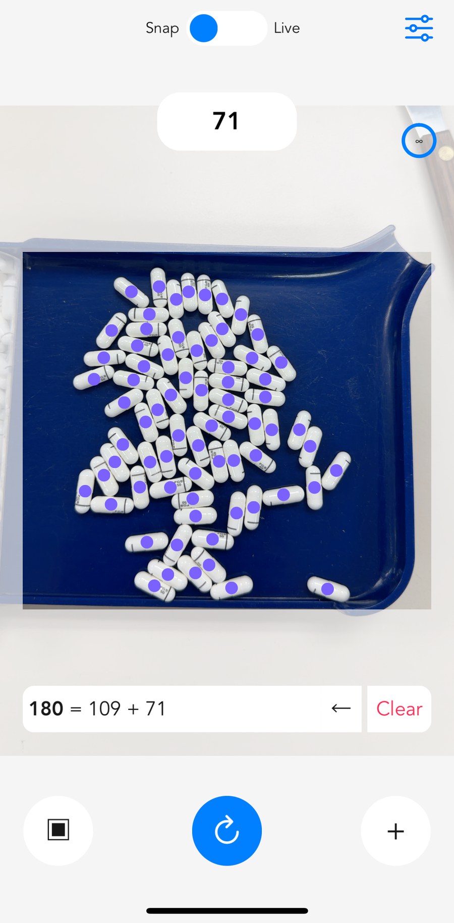 pillphill live-counting a tray of capsules